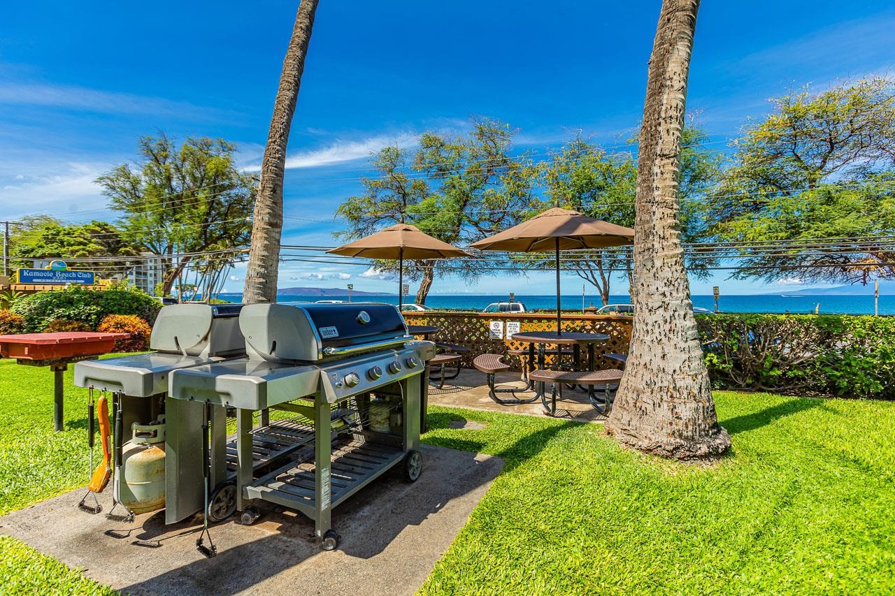 2381 South Kihei Road, Unit B107 Kihei, HI 96753 - Photo 25 of 29 a view of a patio with a table and chairs under an umbrella