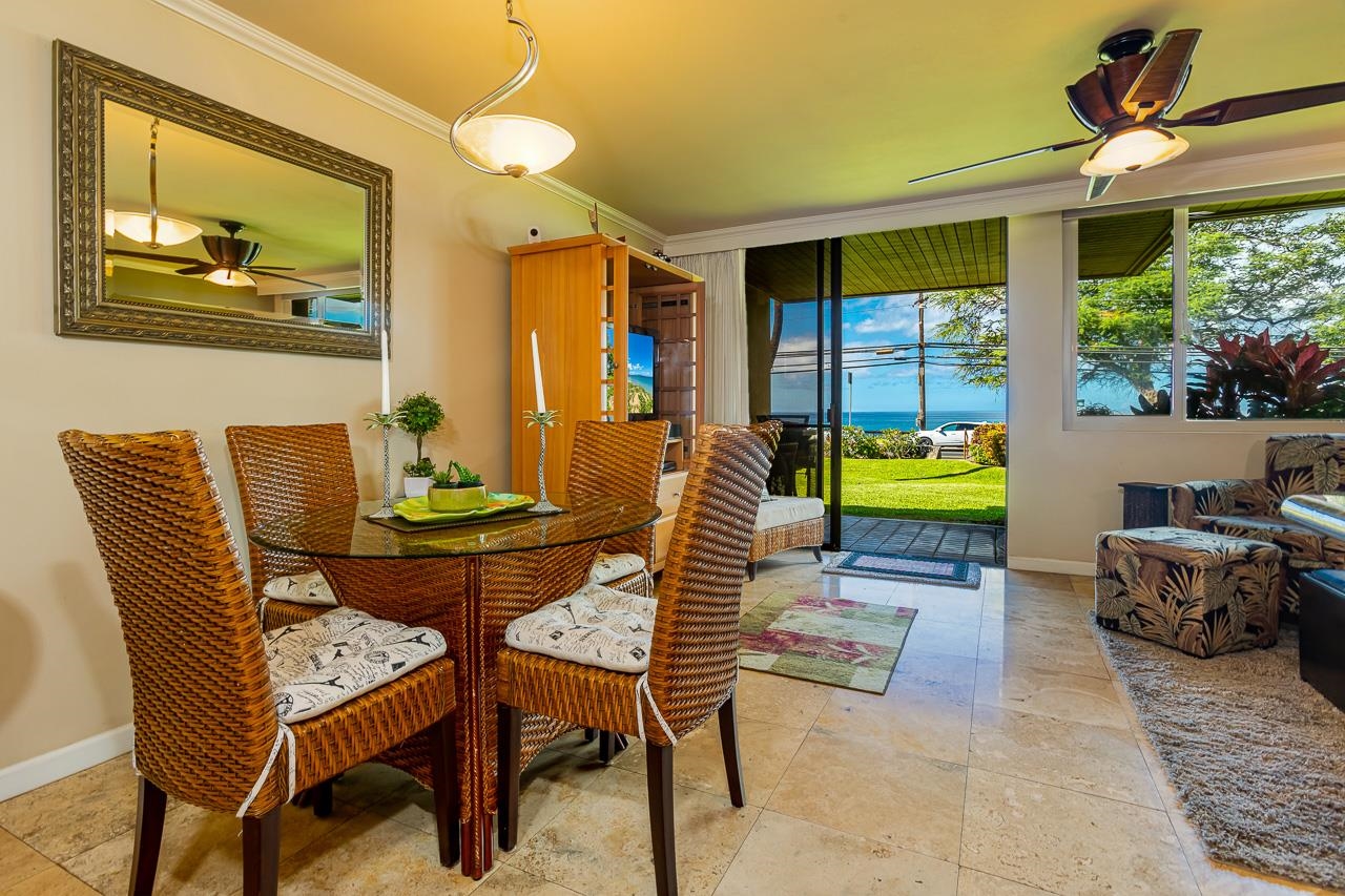 2381 South Kihei Road, Unit B107 Kihei, HI 96753 - Photo 5 of 29 a living room with furniture and a large window