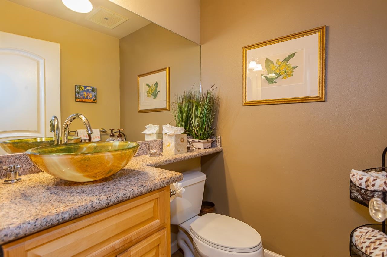 2381 South Kihei Road, Unit B107 Kihei, HI 96753 - Photo 10 of 29 a bathroom with a granite countertop sink a toilet and mirror