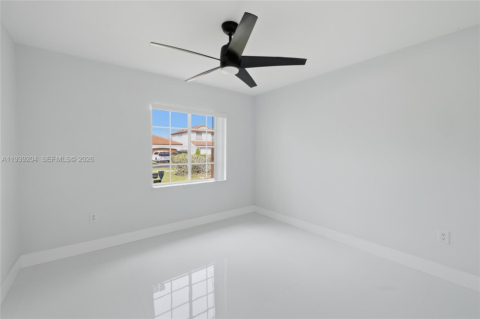 15956 Southwest 83rd Terrace Miami, FL 33193 - Photo 17 of 44 a view of an empty room