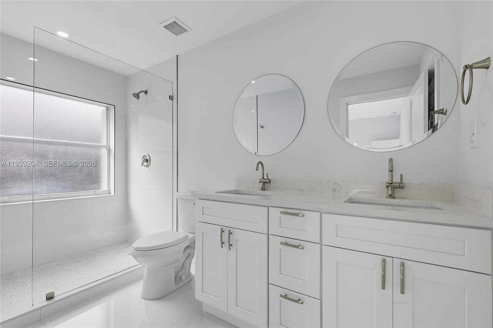 15956 Southwest 83rd Terrace Miami, FL 33193 - Photo 21 of 44 a bathroom with 2 sink toilet and shower