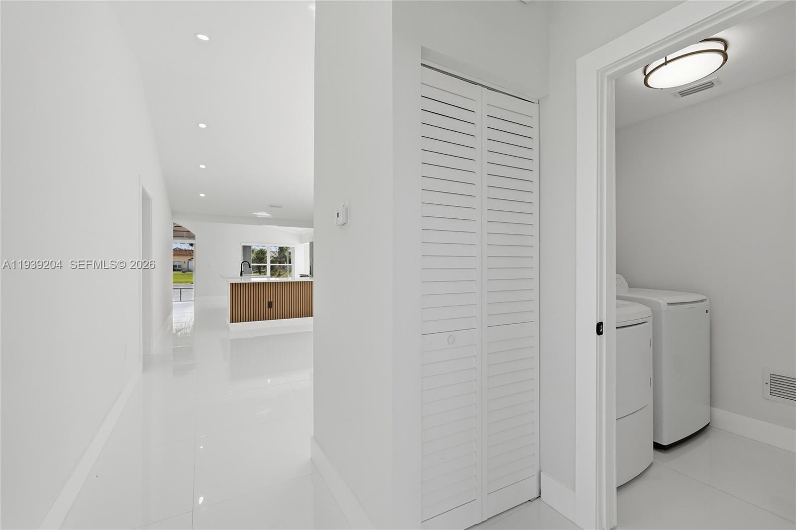 15956 Southwest 83rd Terrace Miami, FL 33193 - Photo 23 of 44 a view of a hallway with a elevator