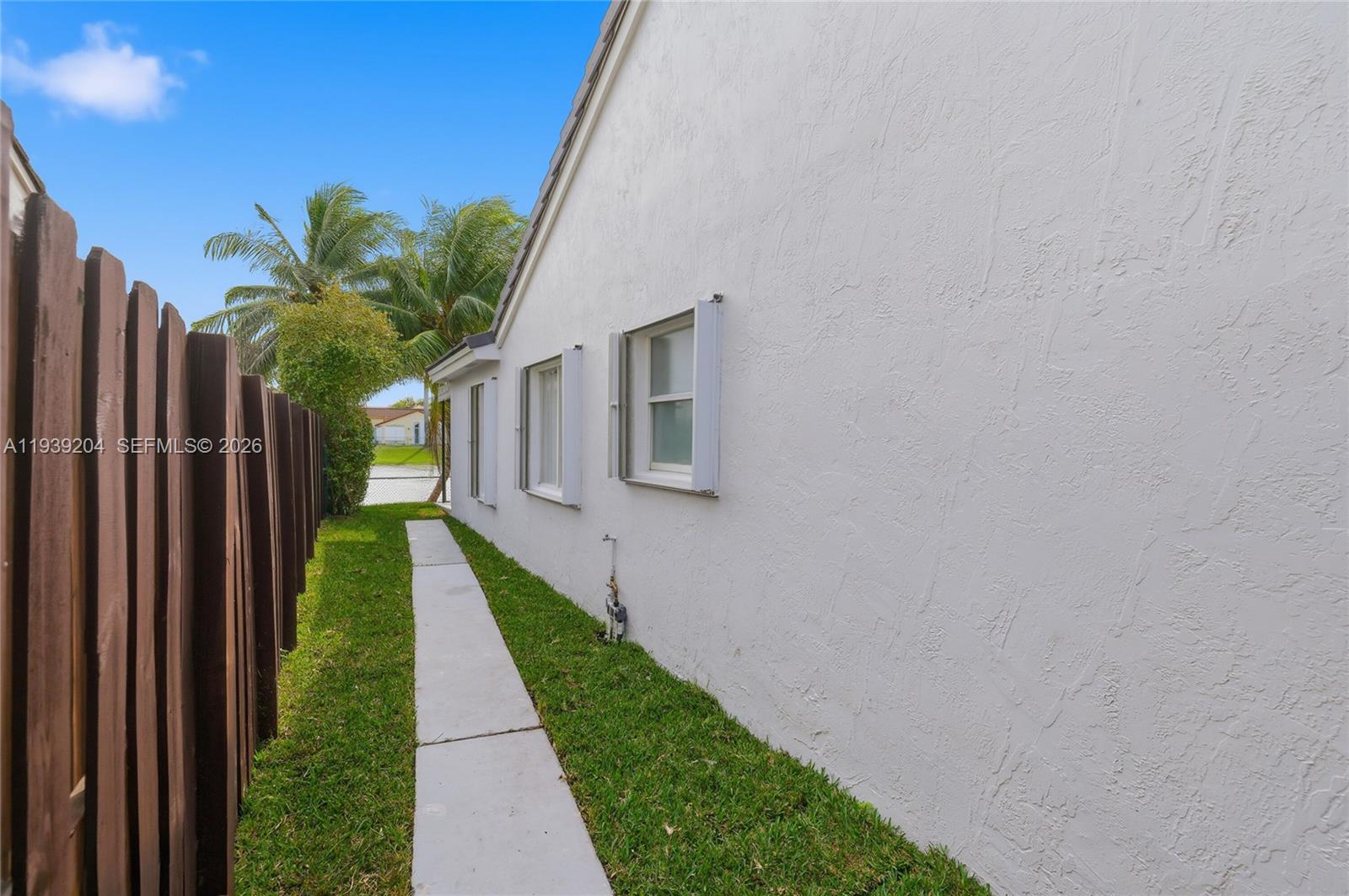 15956 Southwest 83rd Terrace Miami, FL 33193 - Photo 35 of 44 a view of a house with backyard