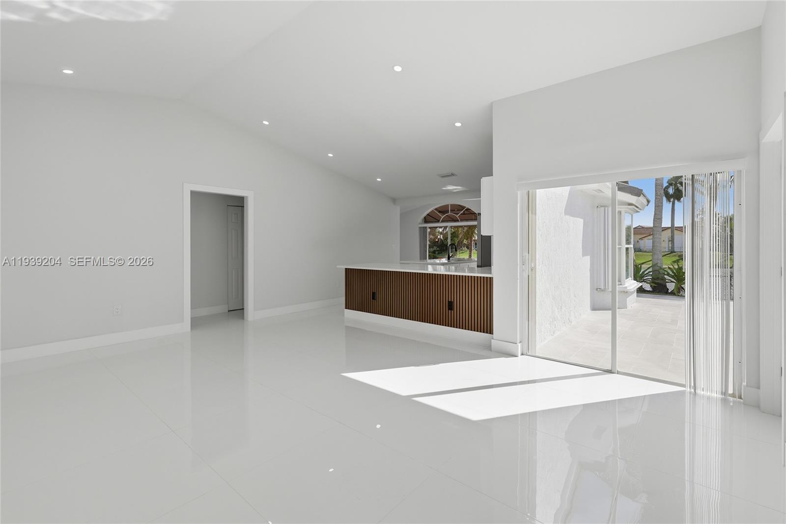 15956 Southwest 83rd Terrace Miami, FL 33193 - Photo 4 of 44 a room with a bed and a cabinets