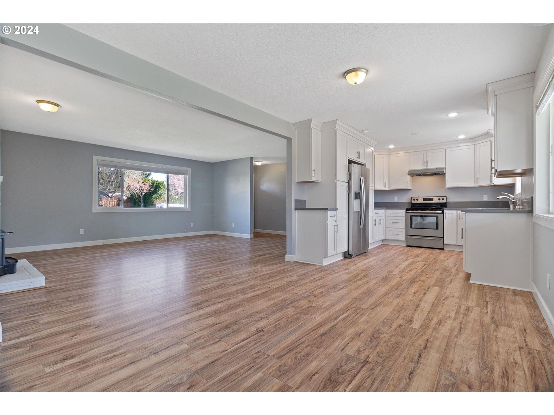 8412 Northeast 27th Avenue Vancouver, WA 98665 - Photo 11 of 36 a view of kitchen with wooden floor and electronic appliances