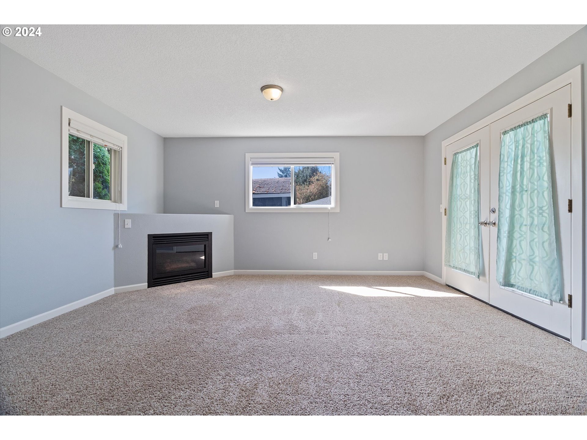 8412 Northeast 27th Avenue Vancouver, WA 98665 - Photo 16 of 36 a view of empty room with a fireplace