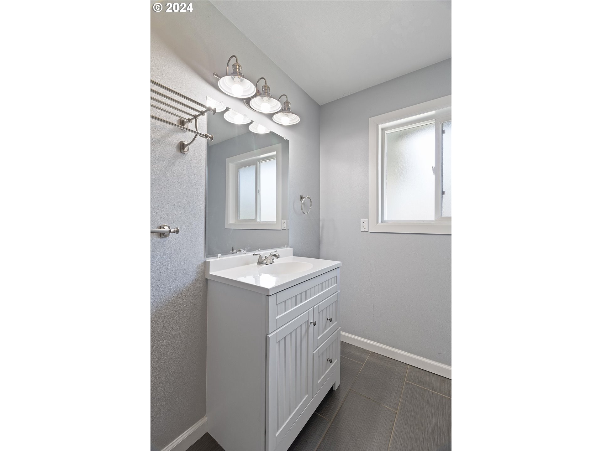 8412 Northeast 27th Avenue Vancouver, WA 98665 - Photo 26 of 36 a view of a bathroom with a sink and a mirror