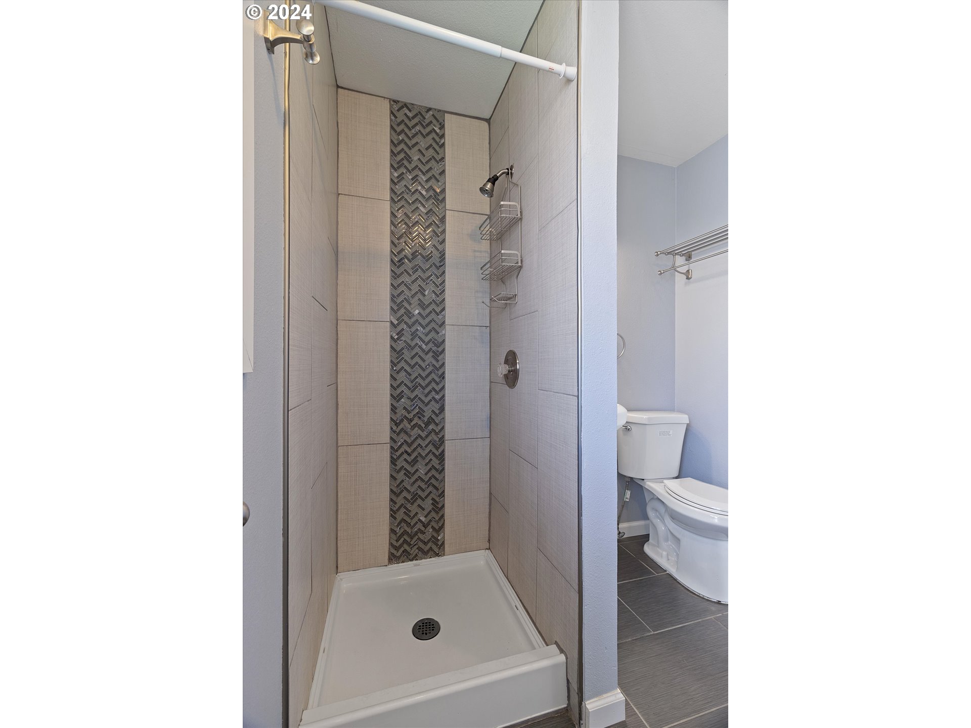 8412 Northeast 27th Avenue Vancouver, WA 98665 - Photo 28 of 36 a bathroom with a toilet and a shower