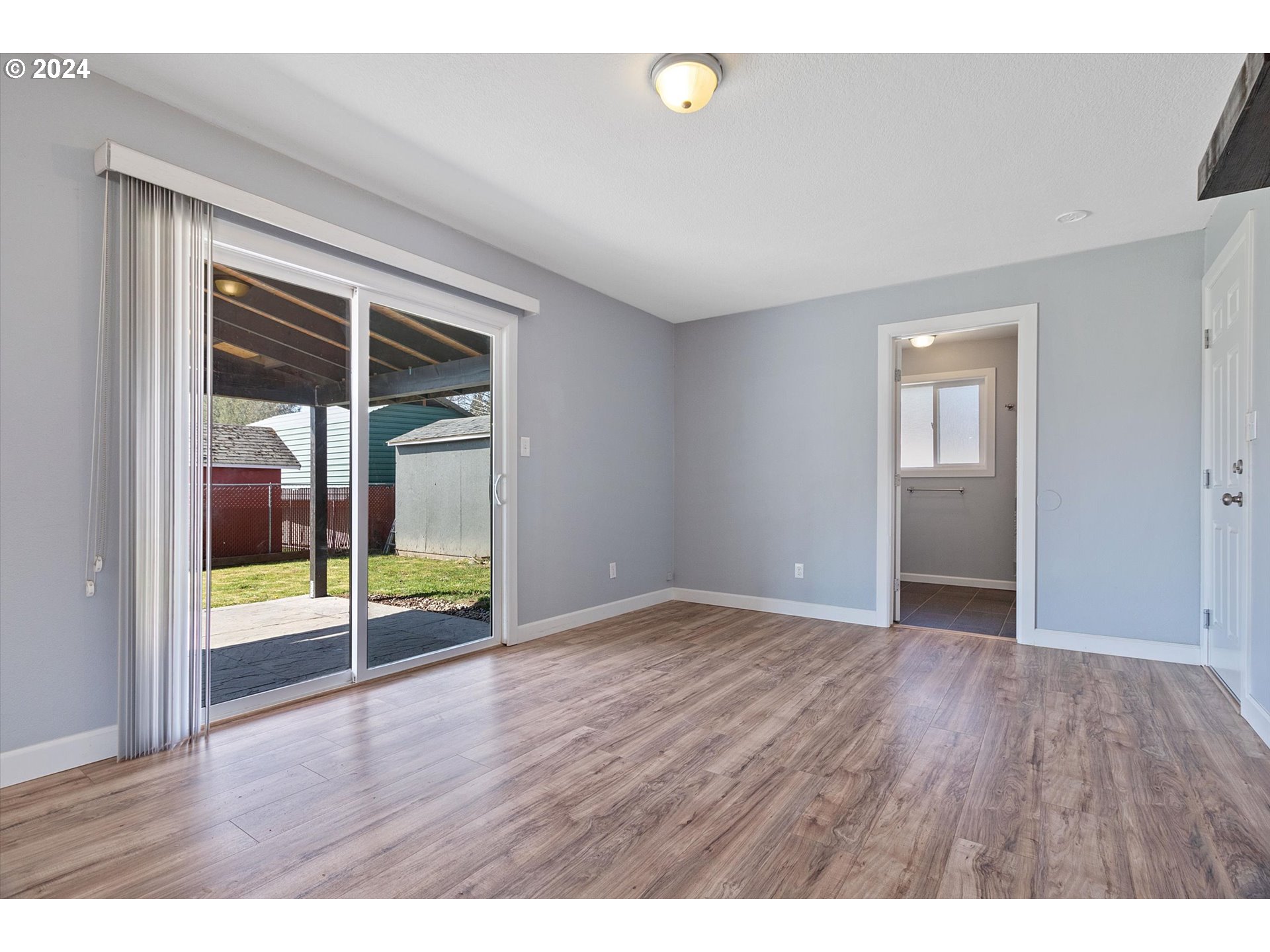 8412 Northeast 27th Avenue Vancouver, WA 98665 - Photo 10 of 36 an empty room with wooden floor and windows
