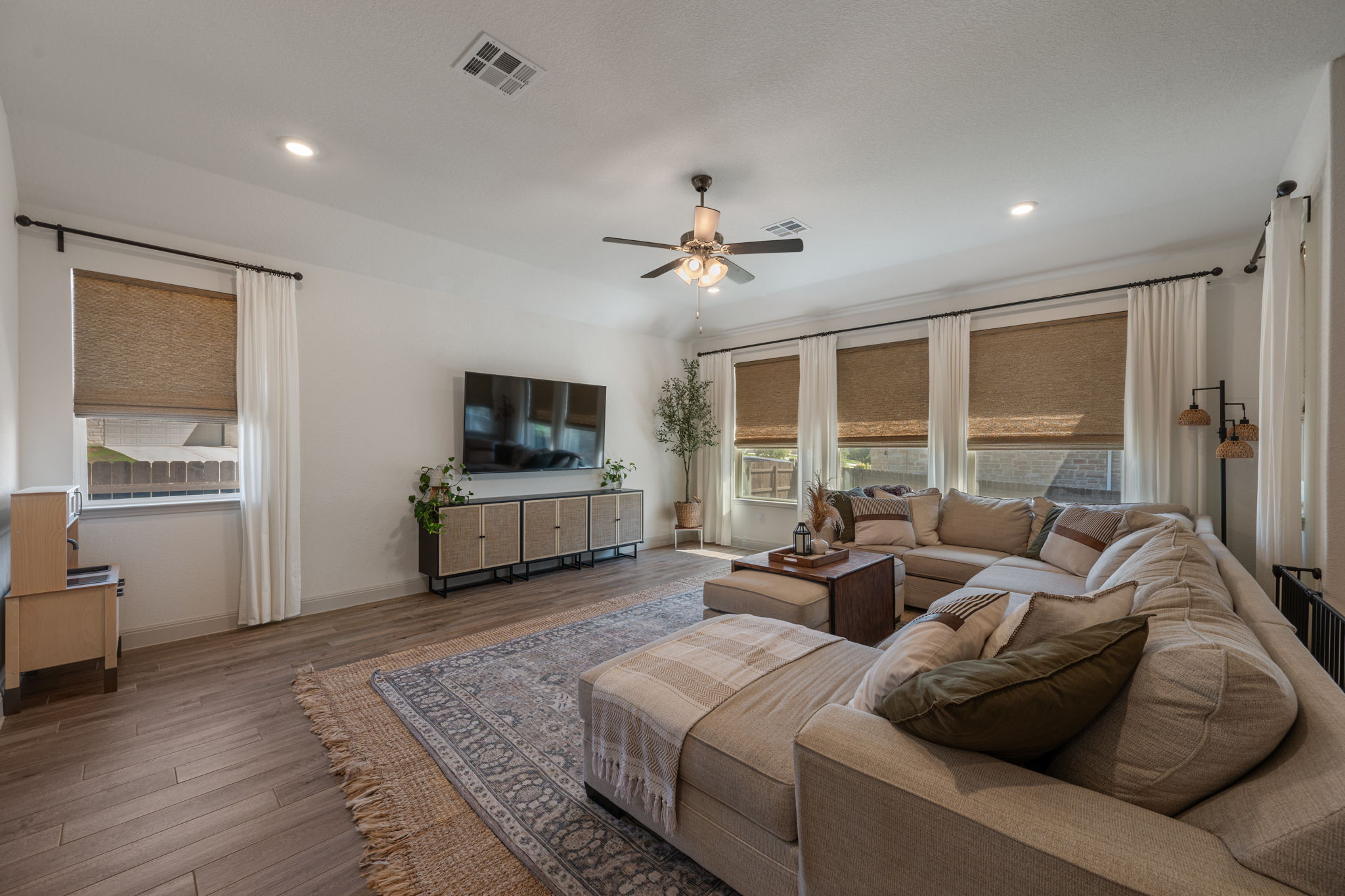 1808 Weavers Bend Georgetown, TX 78628 - Photo 13 of 30 a living room with furniture and a flat screen tv