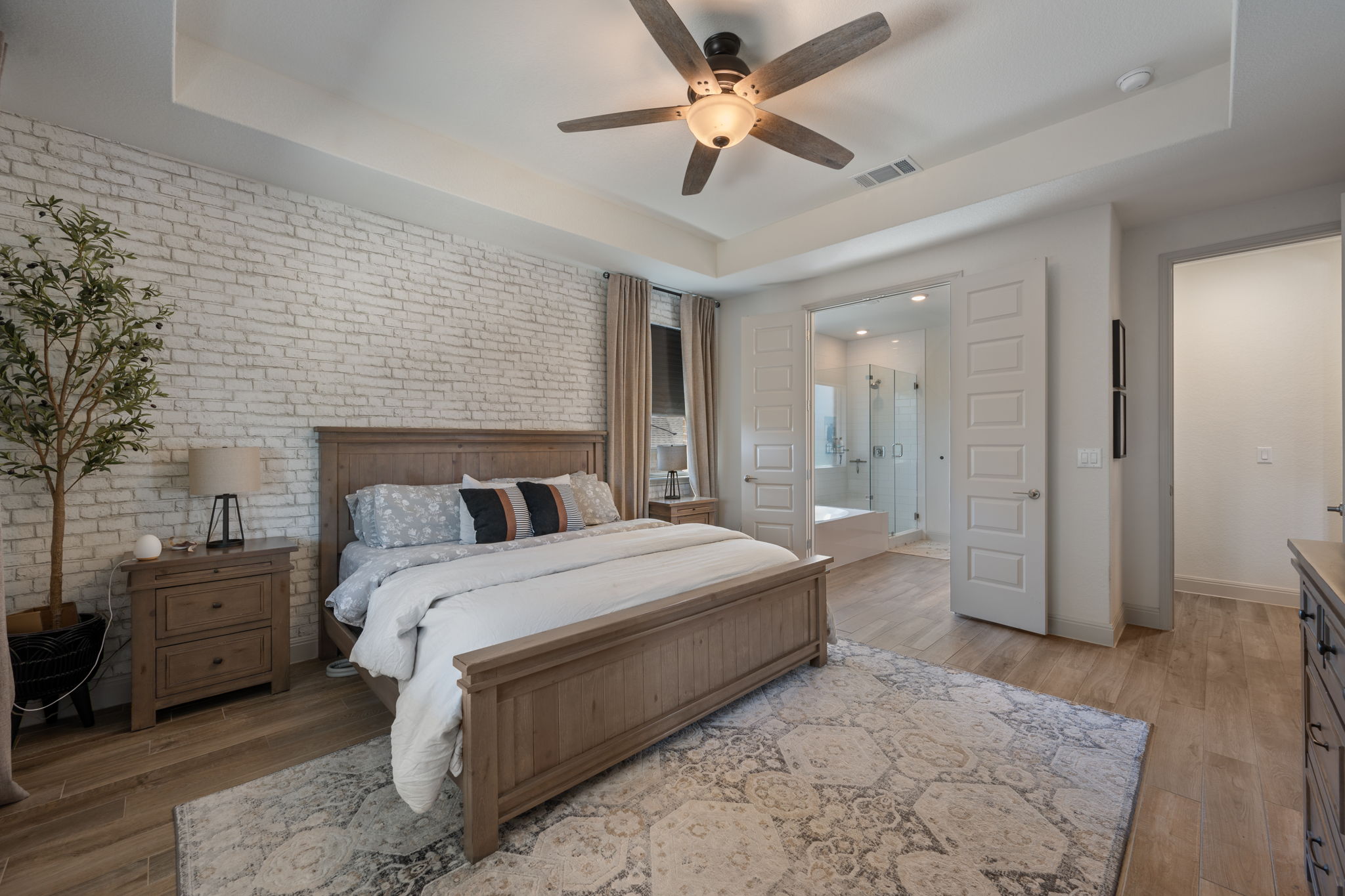 1808 Weavers Bend Georgetown, TX 78628 - Photo 15 of 30 a bedroom with a large bed and a chandelier