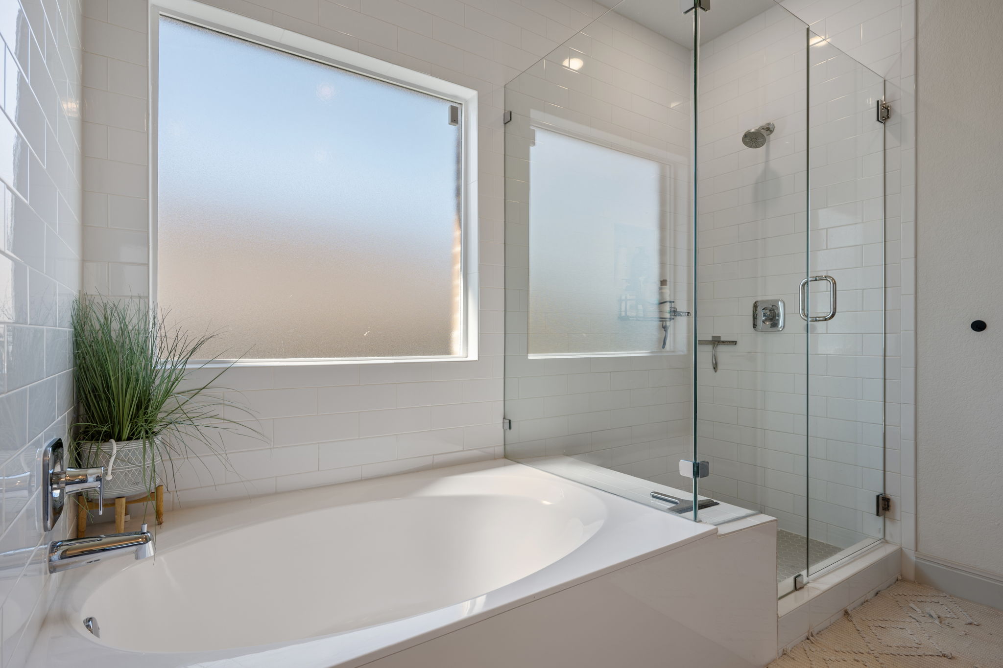 1808 Weavers Bend Georgetown, TX 78628 - Photo 17 of 30 a bathroom with a tub and a shower