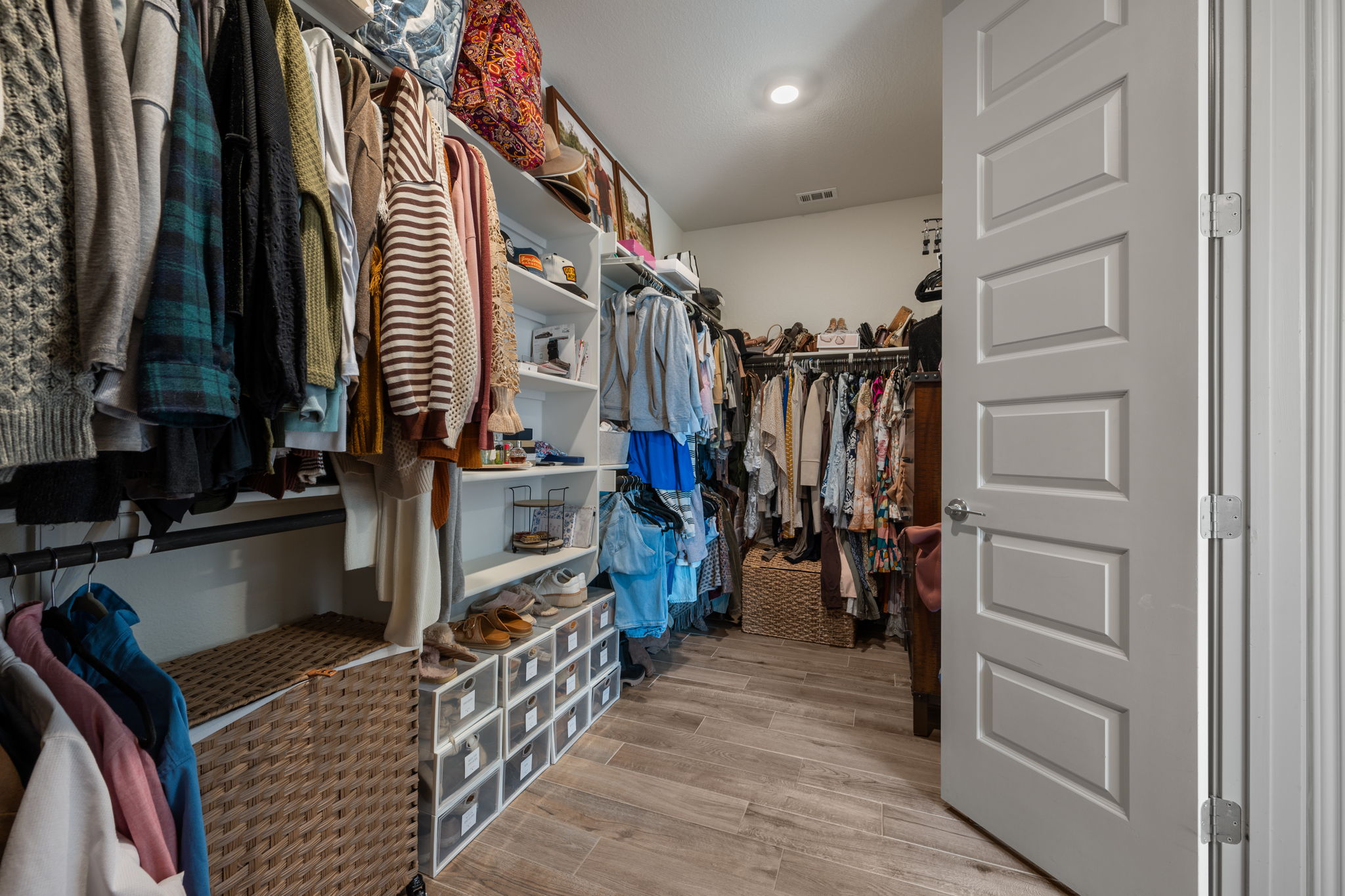 1808 Weavers Bend Georgetown, TX 78628 - Photo 18 of 30 a view of walk in closet with clothes and shoes
