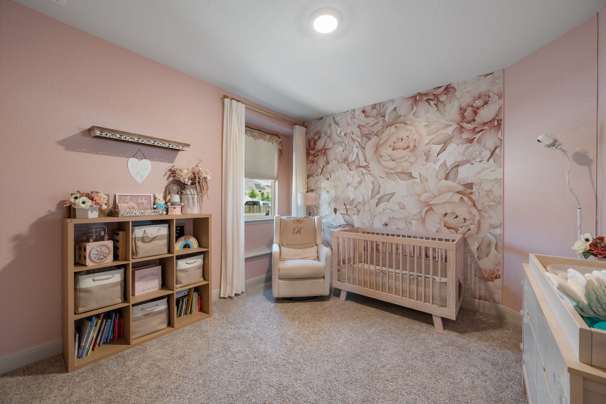 1808 Weavers Bend Georgetown, TX 78628 - Photo 20 of 30 a bedroom with a baby bed a couch and a window