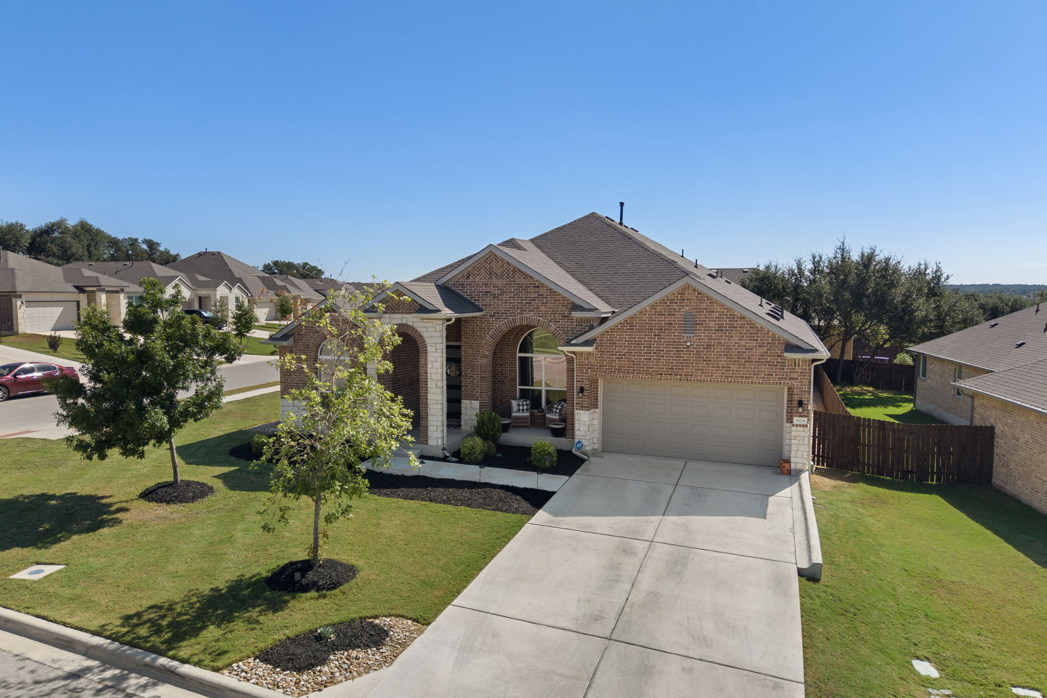 1808 Weavers Bend Georgetown, TX 78628 - Photo 27 of 30 a front view of house with yard and trees in the background