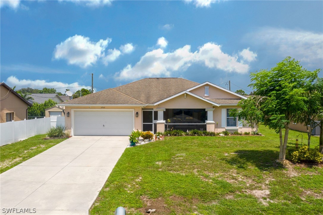 17557 Ingram Road Fort Myers, FL 33967 - Photo 1 of 29 a front view of a house with yard and green space