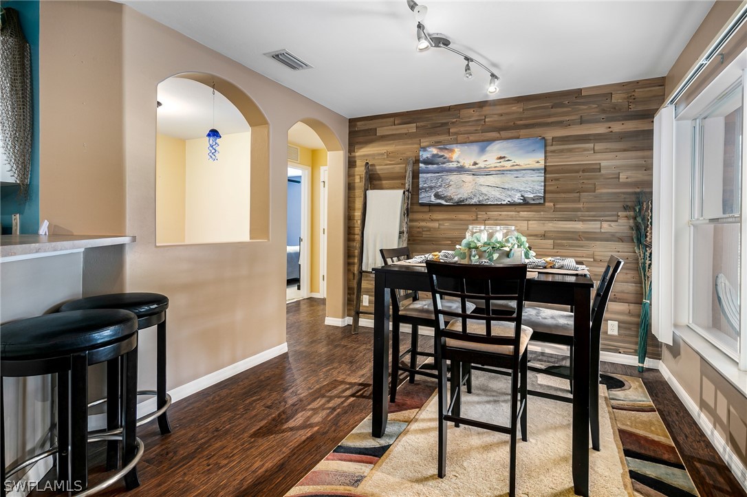 17557 Ingram Road Fort Myers, FL 33967 - Photo 13 of 29 a view of a dining room with furniture and wooden floor