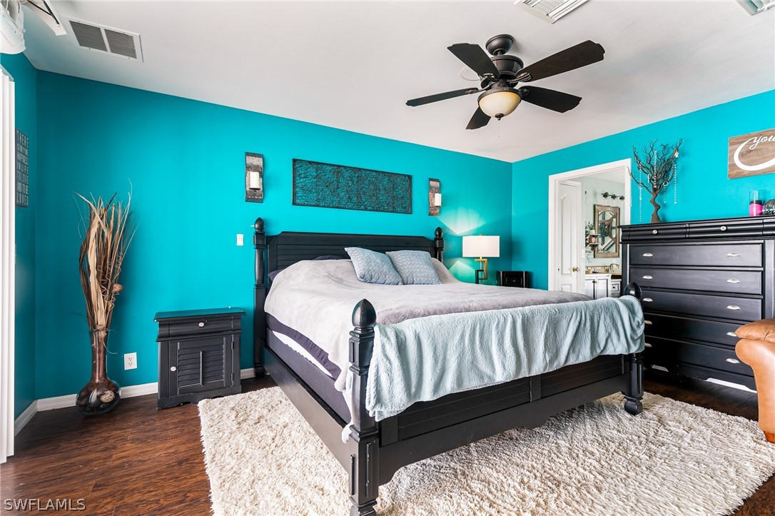 17557 Ingram Road Fort Myers, FL 33967 - Photo 14 of 29 a bed sitting in a bedroom next to a window