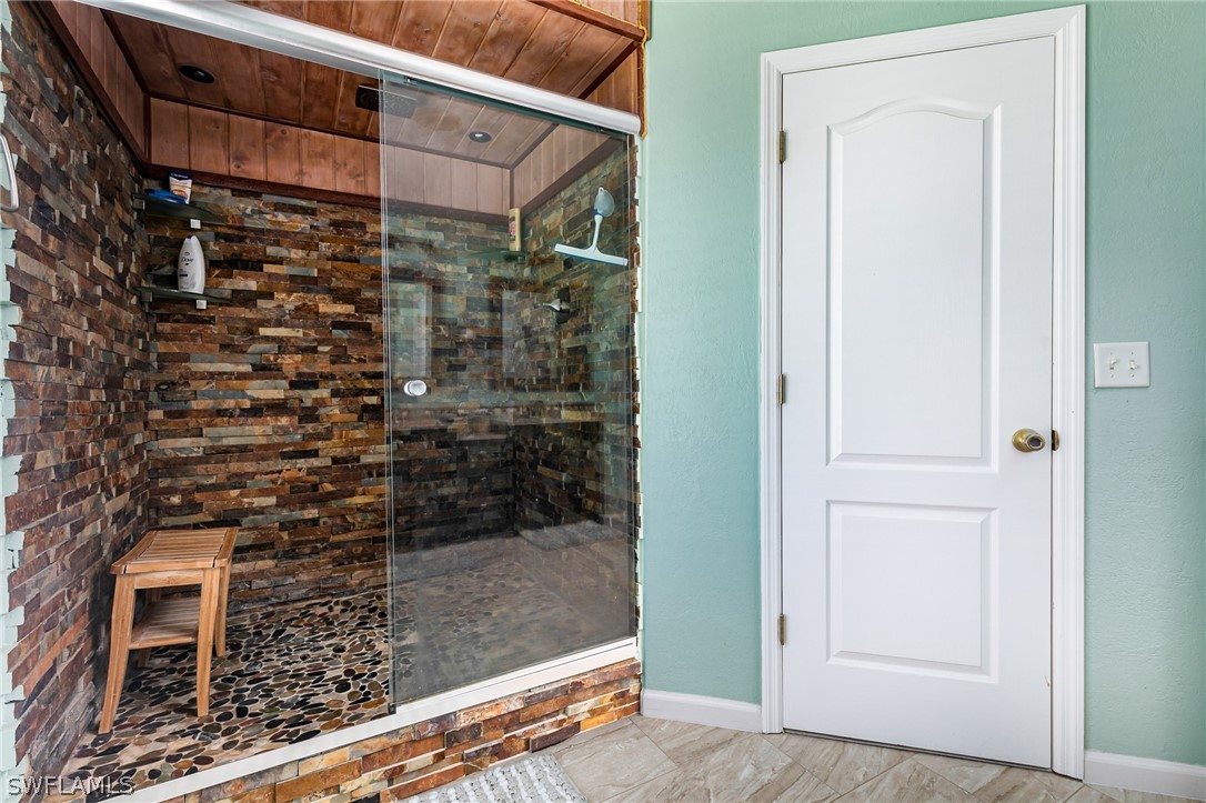 17557 Ingram Road Fort Myers, FL 33967 - Photo 17 of 29 a bathroom with a shower
