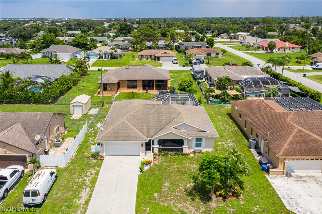 17557 Ingram Road Fort Myers, FL 33967 - Photo 2 of 29 an aerial view of multiple houses with a big yard
