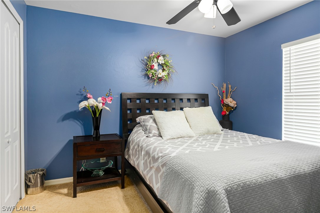 17557 Ingram Road Fort Myers, FL 33967 - Photo 22 of 29 a bed sitting in a bedroom next to a window