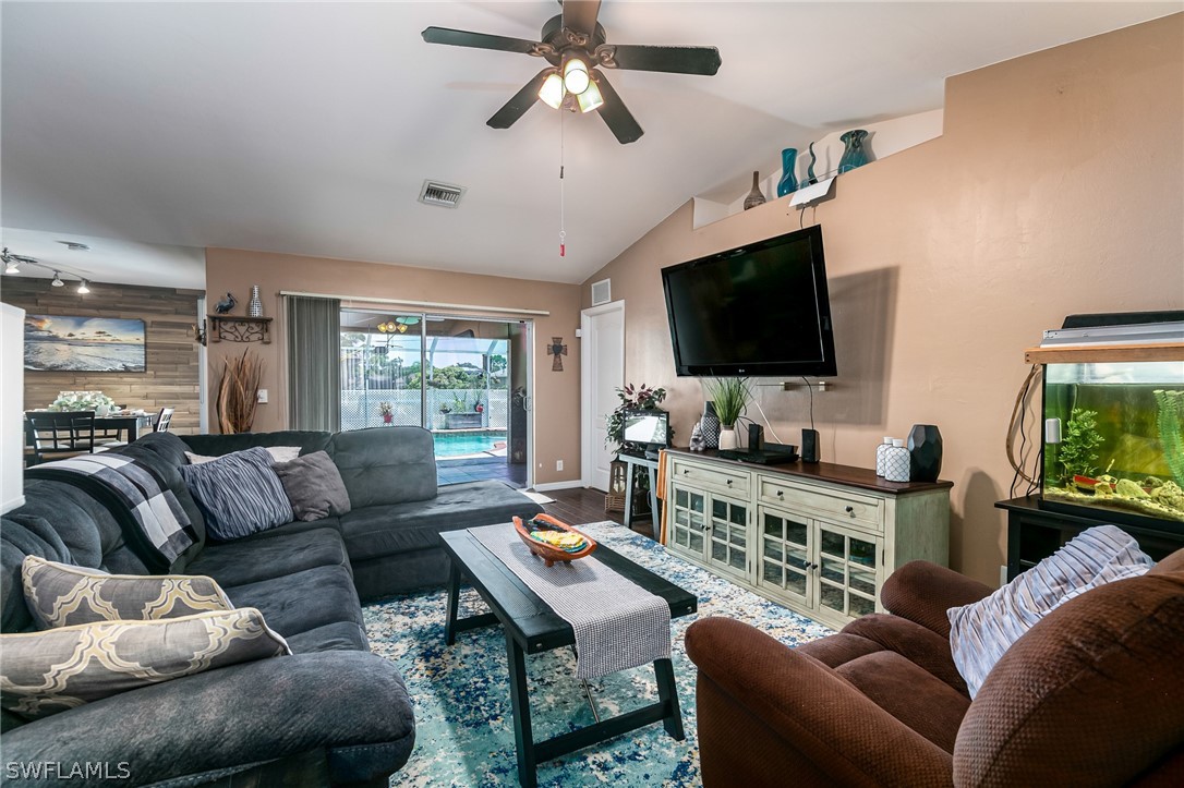 17557 Ingram Road Fort Myers, FL 33967 - Photo 5 of 29 a living room with furniture and a flat screen tv