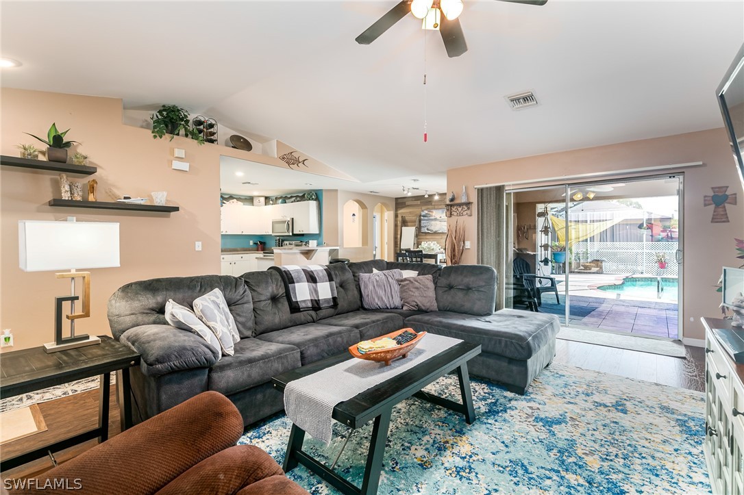 17557 Ingram Road Fort Myers, FL 33967 - Photo 7 of 29 a living room with furniture wooden floor and a large window