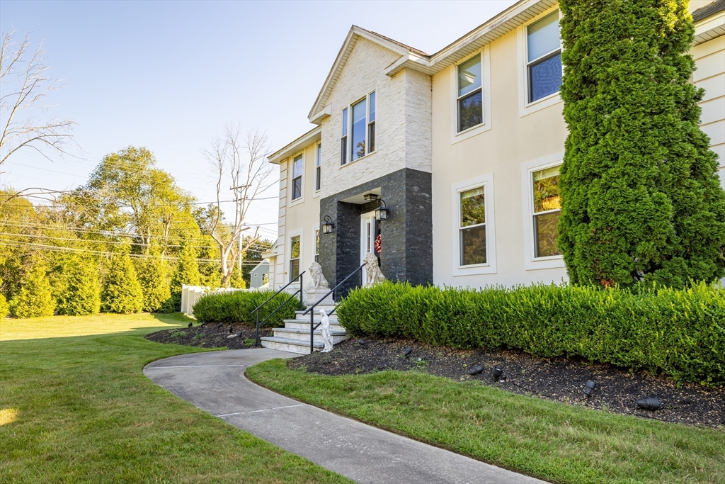 2 Nollet Drive Andover, MA 01810 - Photo 2 of 9 a front view of a house with garden