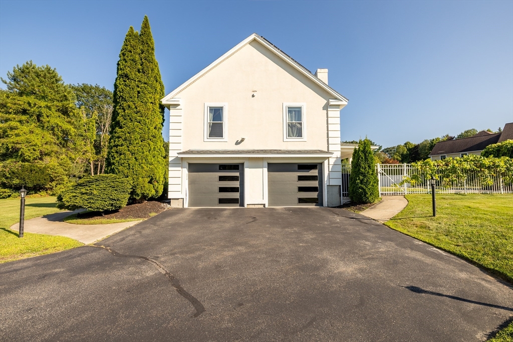 2 Nollet Drive Andover, MA 01810 - Photo 9 of 9 a view of a house with a yard and garage