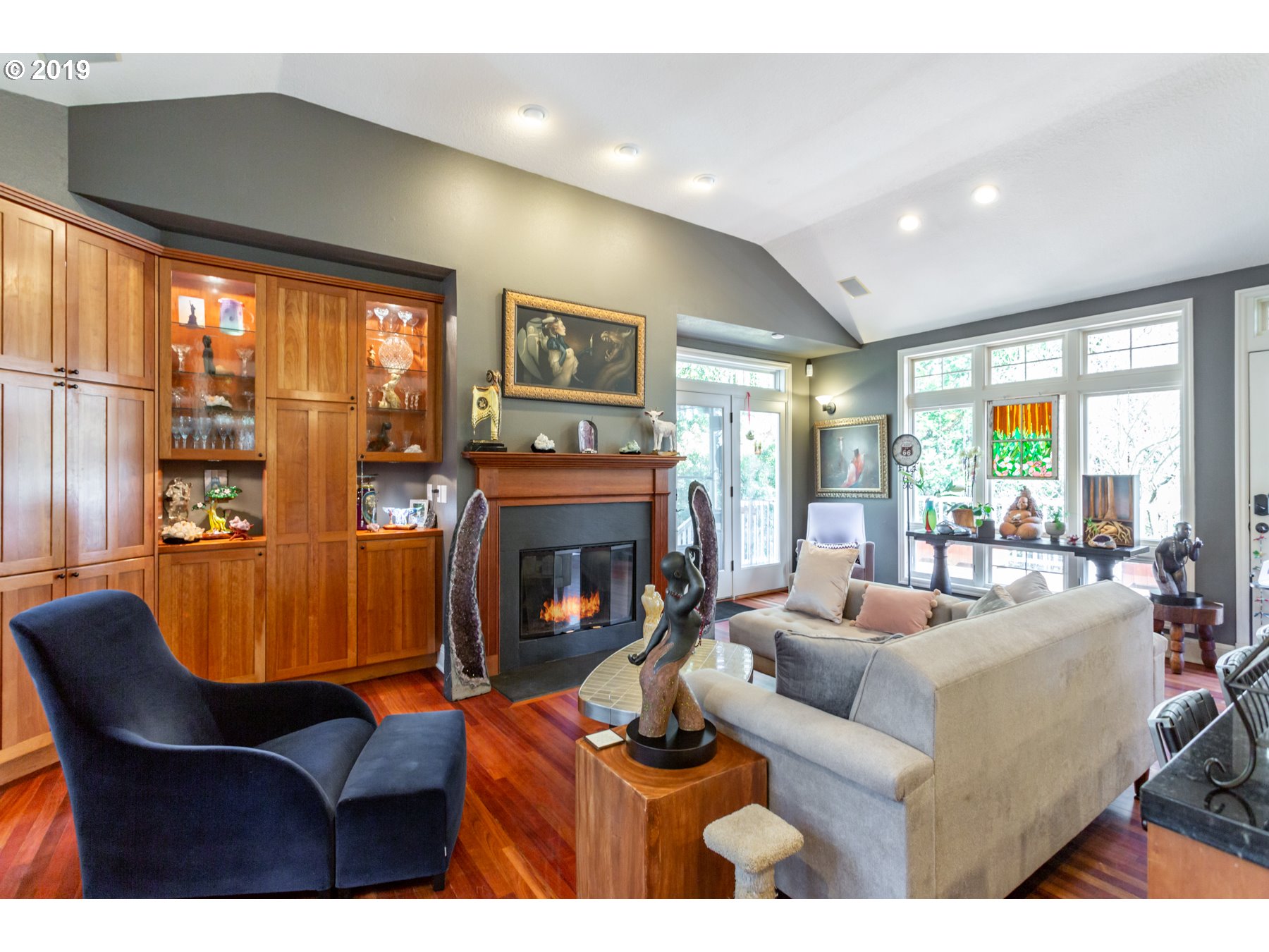 731 Southwest Bancroft Terrace Portland, OR 97239 - Photo 12 of 46 a living room with fireplace furniture and a large window