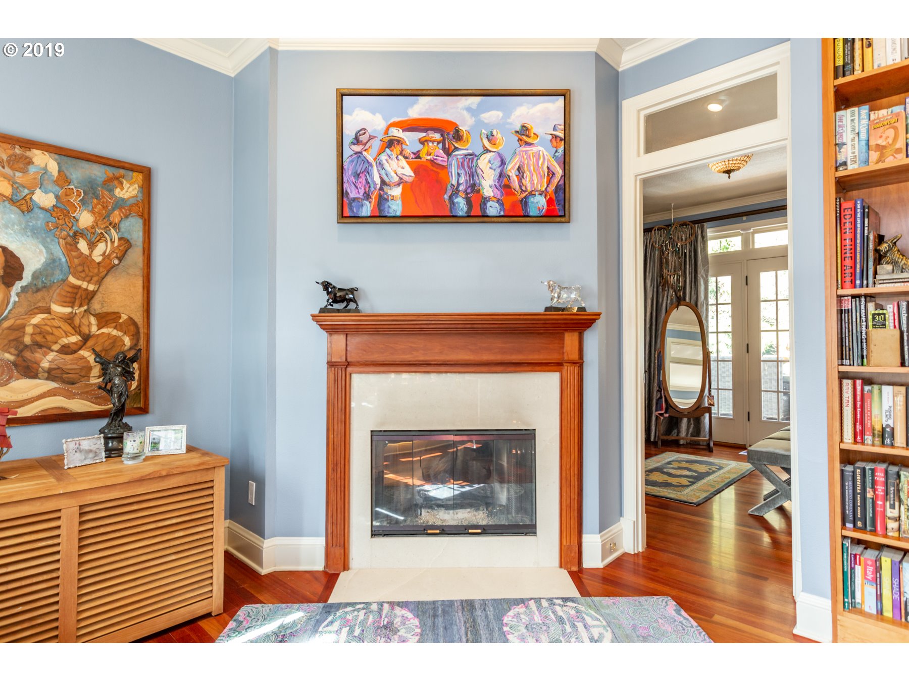 731 Southwest Bancroft Terrace Portland, OR 97239 - Photo 14 of 46 a view of a living room with a fireplace and a bookshelf