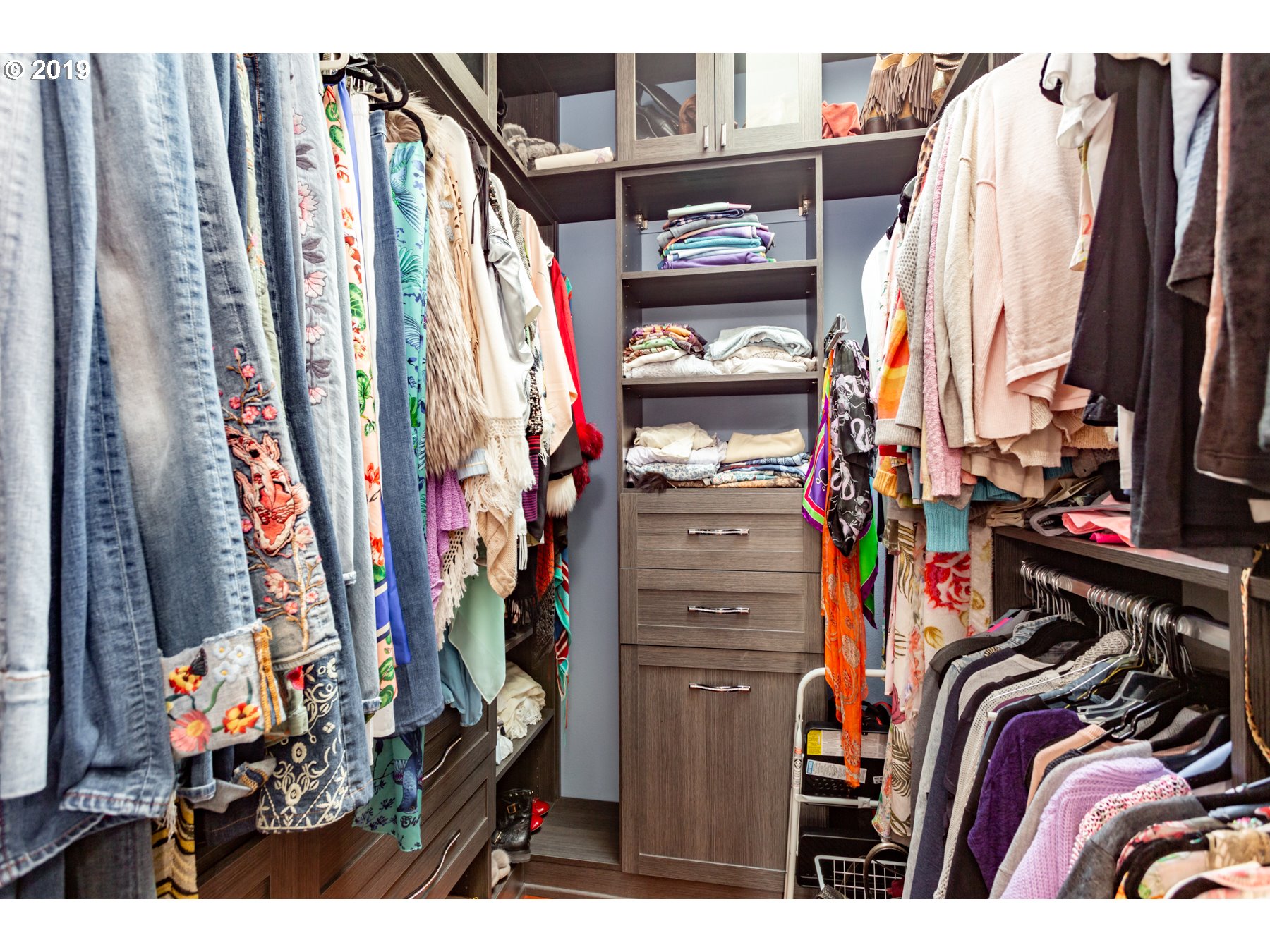731 Southwest Bancroft Terrace Portland, OR 97239 - Photo 18 of 46 a view of walk in closet with clothes