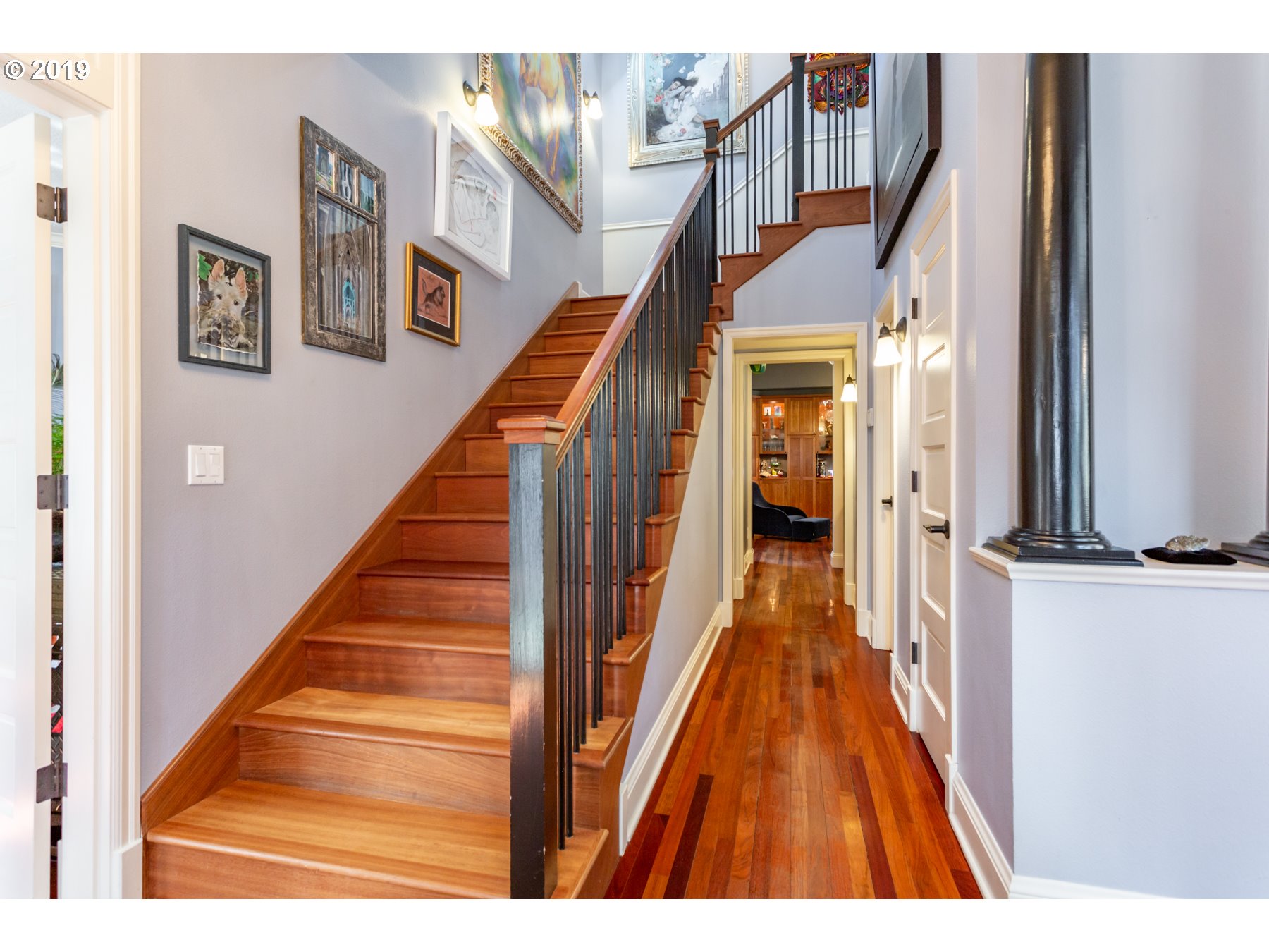 731 Southwest Bancroft Terrace Portland, OR 97239 - Photo 20 of 46 a view of a hallway with wooden floor and stairs