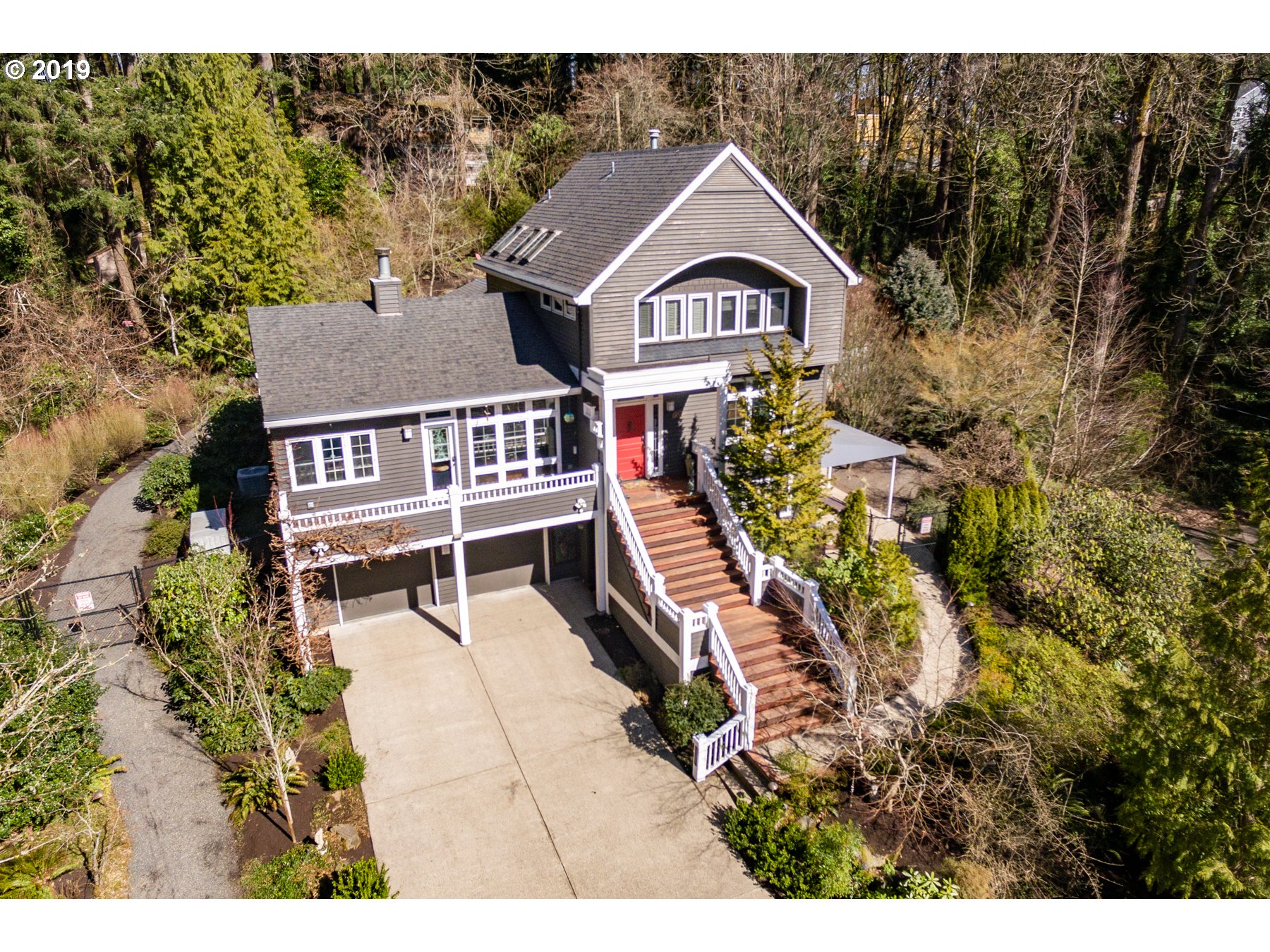731 Southwest Bancroft Terrace Portland, OR 97239 - Photo 2 of 46 a view of a house with a yard and potted plants