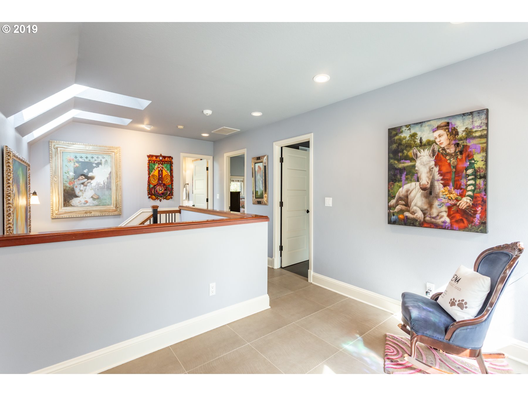 731 Southwest Bancroft Terrace Portland, OR 97239 - Photo 21 of 46 a living room with furniture and a flat screen tv