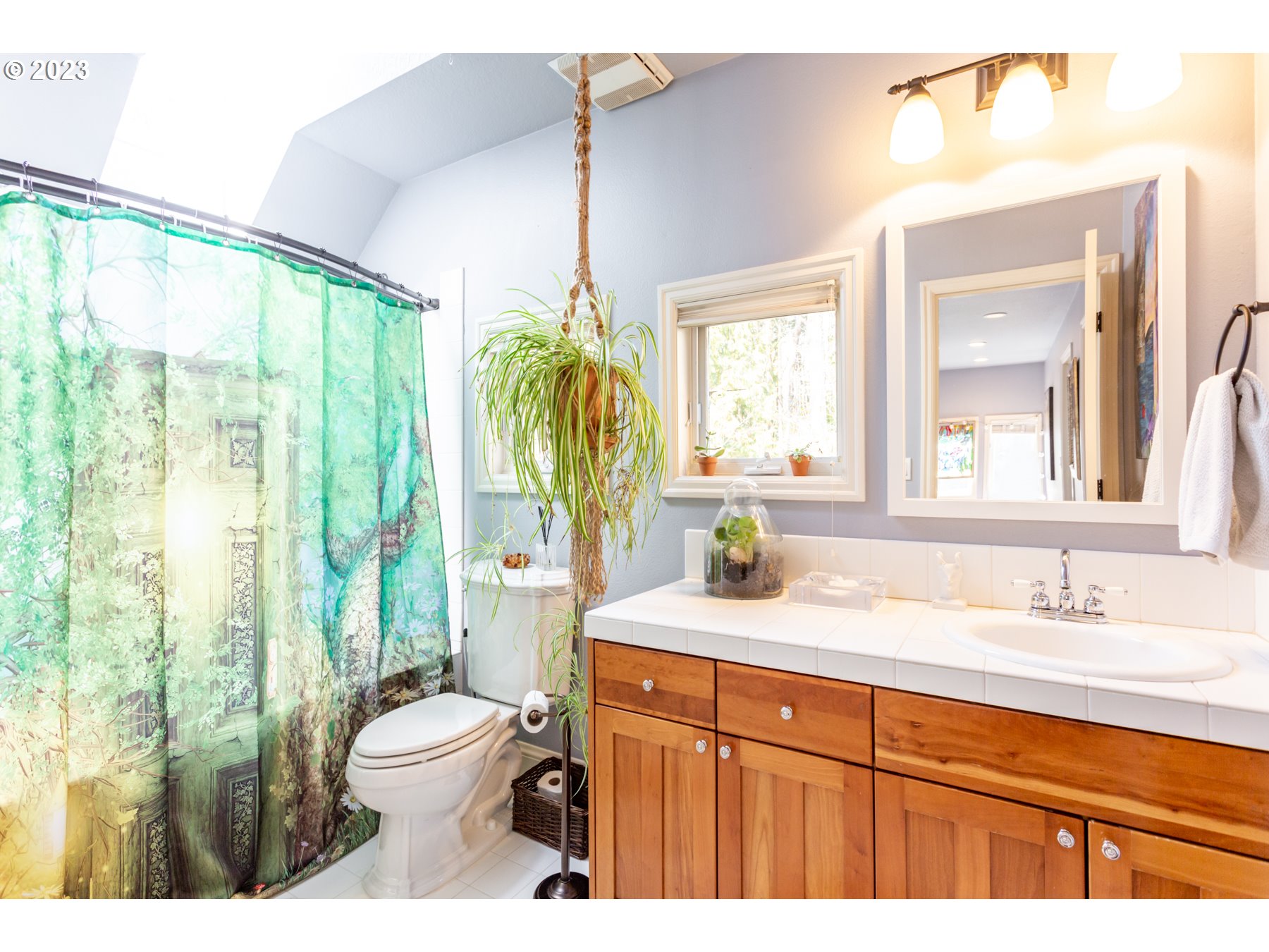 731 Southwest Bancroft Terrace Portland, OR 97239 - Photo 23 of 46 a bathroom with a granite countertop sink toilet and shower