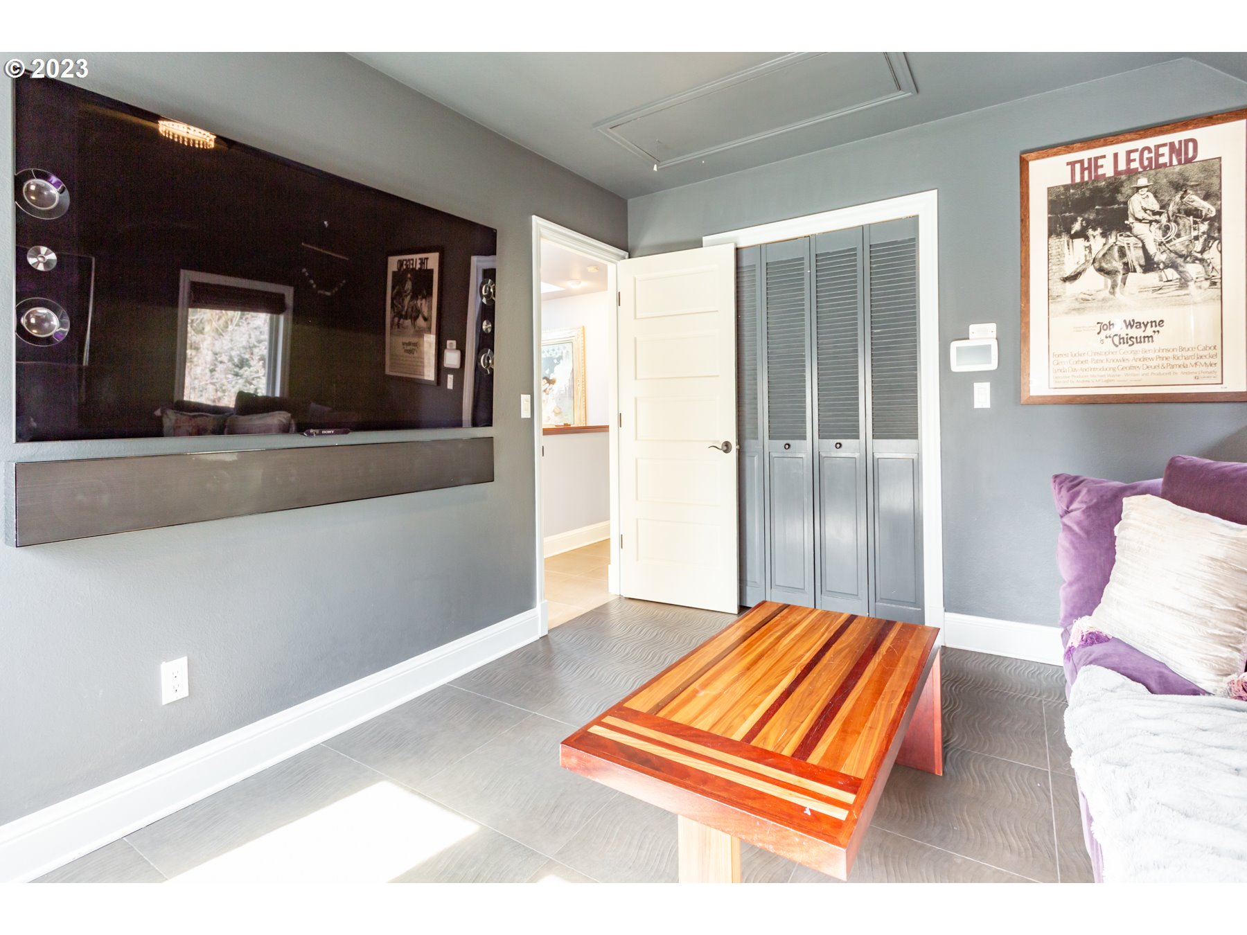 731 Southwest Bancroft Terrace Portland, OR 97239 - Photo 25 of 46 a bedroom with a bed and a painting on the wall