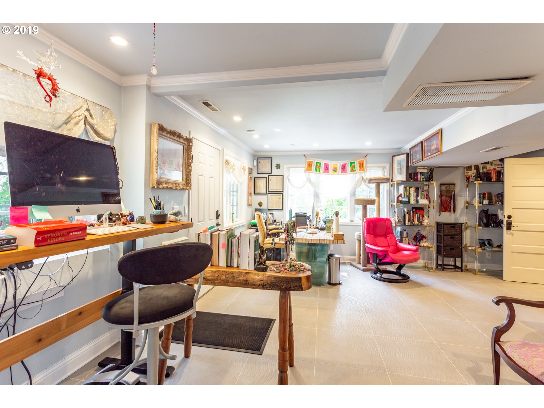 731 Southwest Bancroft Terrace Portland, OR 97239 - Photo 26 of 46 a living room with furniture a flat screen tv and a table
