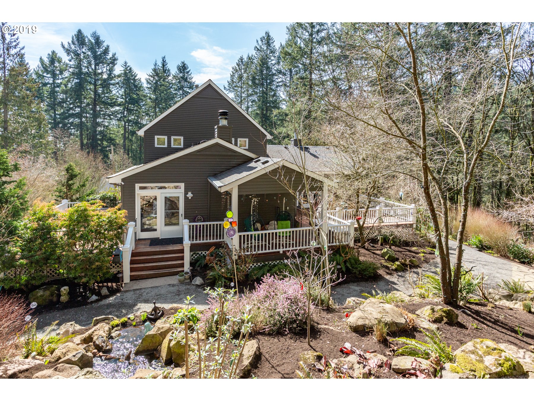 731 Southwest Bancroft Terrace Portland, OR 97239 - Photo 29 of 46 a front view of house with a garden