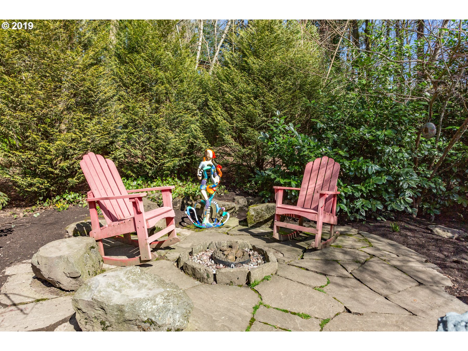 731 Southwest Bancroft Terrace Portland, OR 97239 - Photo 38 of 46 a backyard of a house with table and chairs