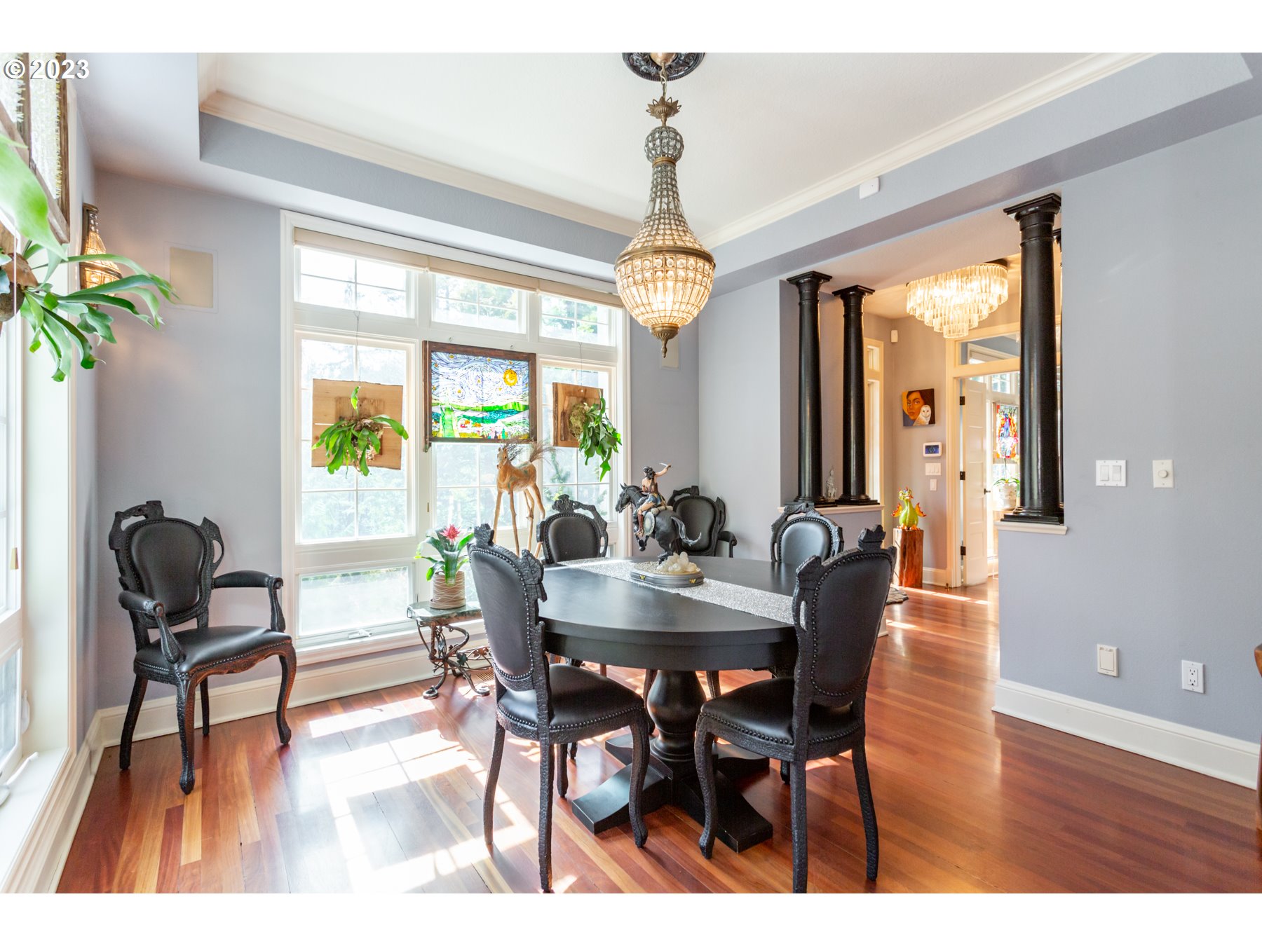 731 Southwest Bancroft Terrace Portland, OR 97239 - Photo 10 of 46 a view of a dining room with furniture window and wooden floor