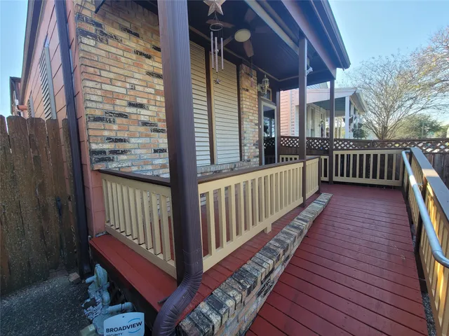 a view of a balcony with wooden floor