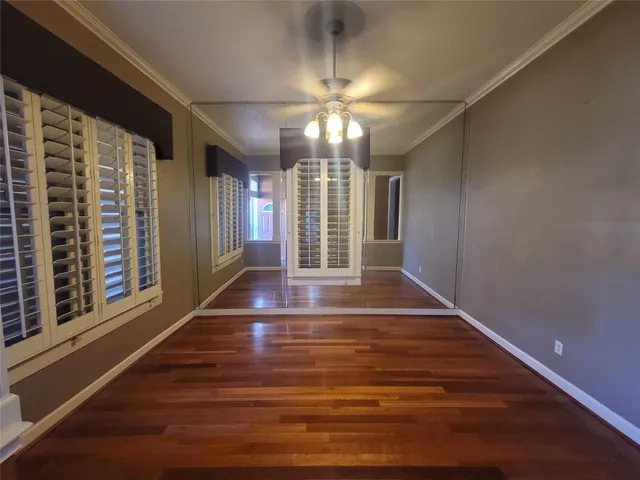 a view of an entryway with wooden floor