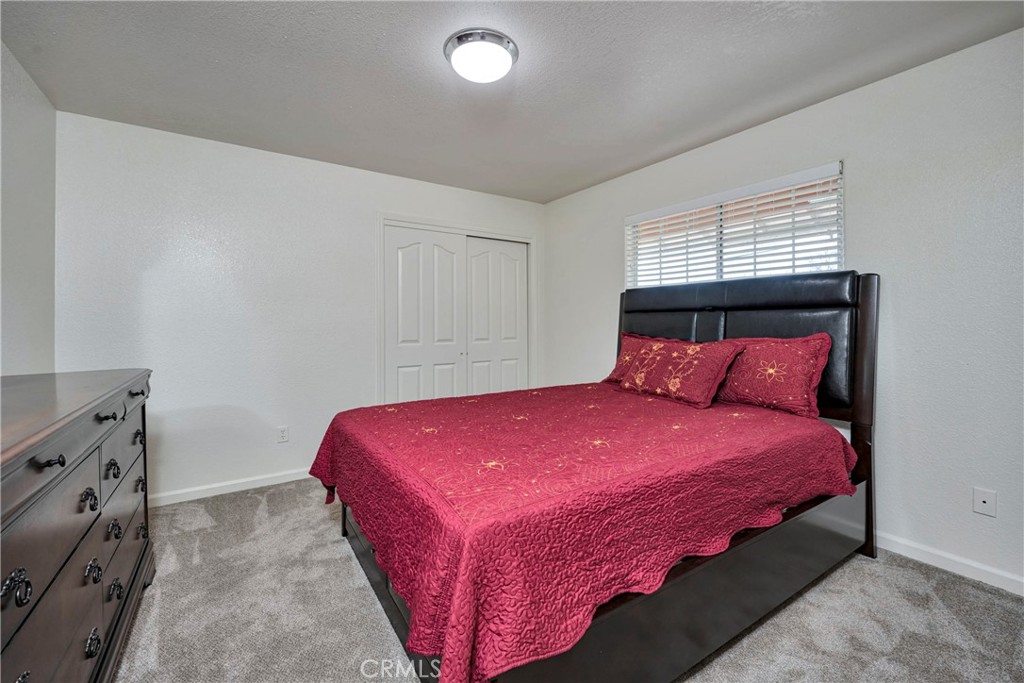 18230 Hidden Valley Road Hidden Valley Lake, CA 95467 - Photo 15 of 22 a bedroom with a bed and window