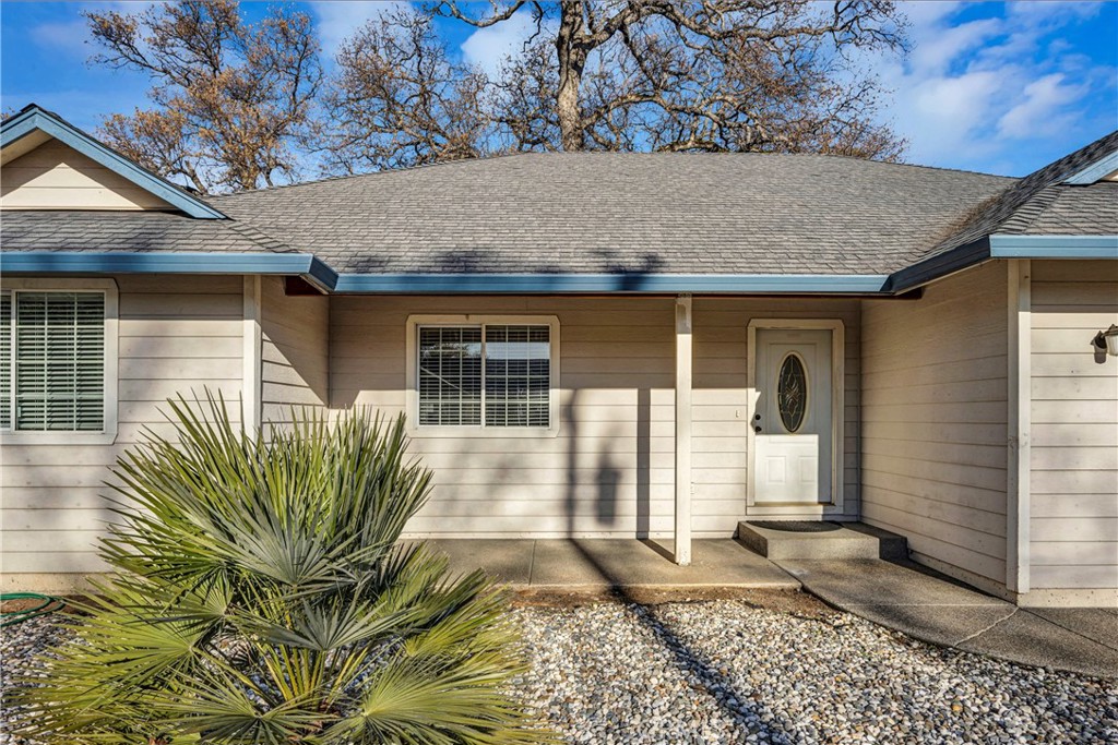 18230 Hidden Valley Road Hidden Valley Lake, CA 95467 - Photo 3 of 22 a front view of a house with garden