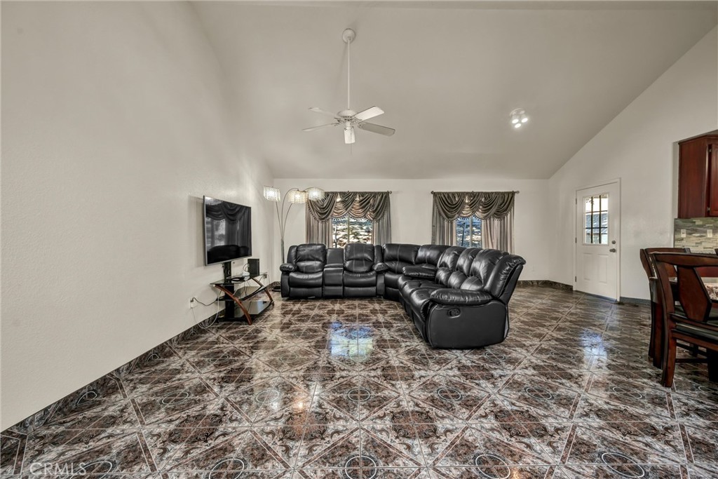 18230 Hidden Valley Road Hidden Valley Lake, CA 95467 - Photo 5 of 22 a living room with furniture a dining table and a piano table