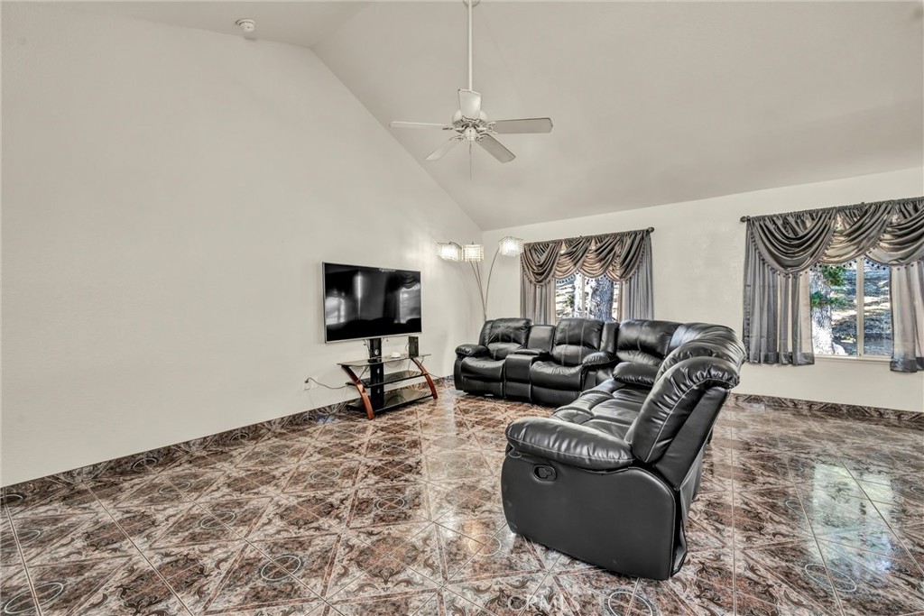 18230 Hidden Valley Road Hidden Valley Lake, CA 95467 - Photo 6 of 22 a living room with furniture and a flat screen tv