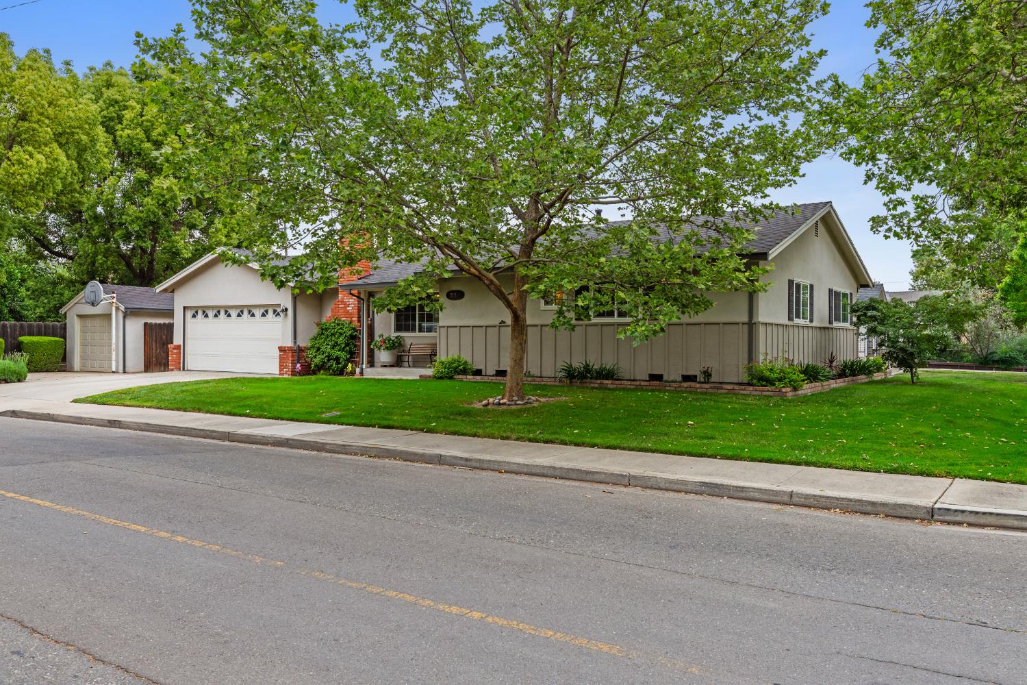 550 Bell Street Turlock, CA 95380 - Photo 3 of 36 a front view of house with yard and green space