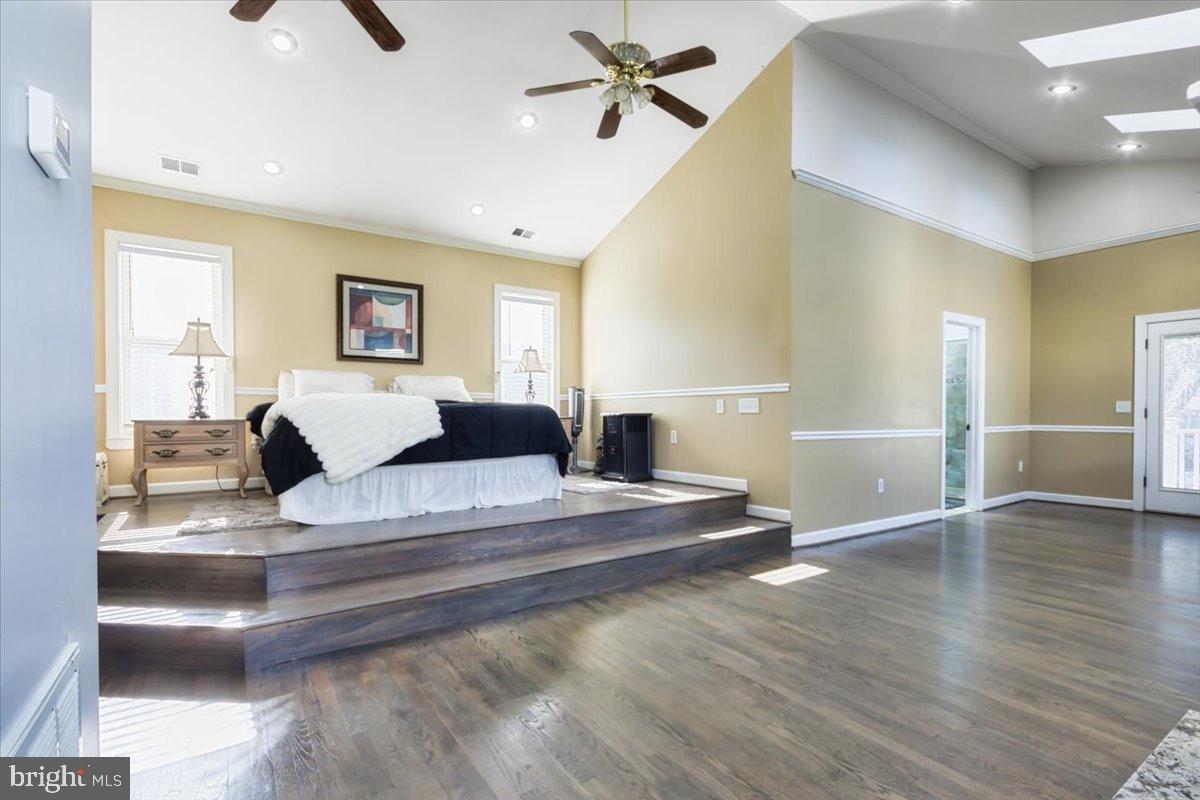 5306 Morello Road Baltimore, MD 21214 - Photo 24 of 37 a spacious bedroom with a bed a window and couch