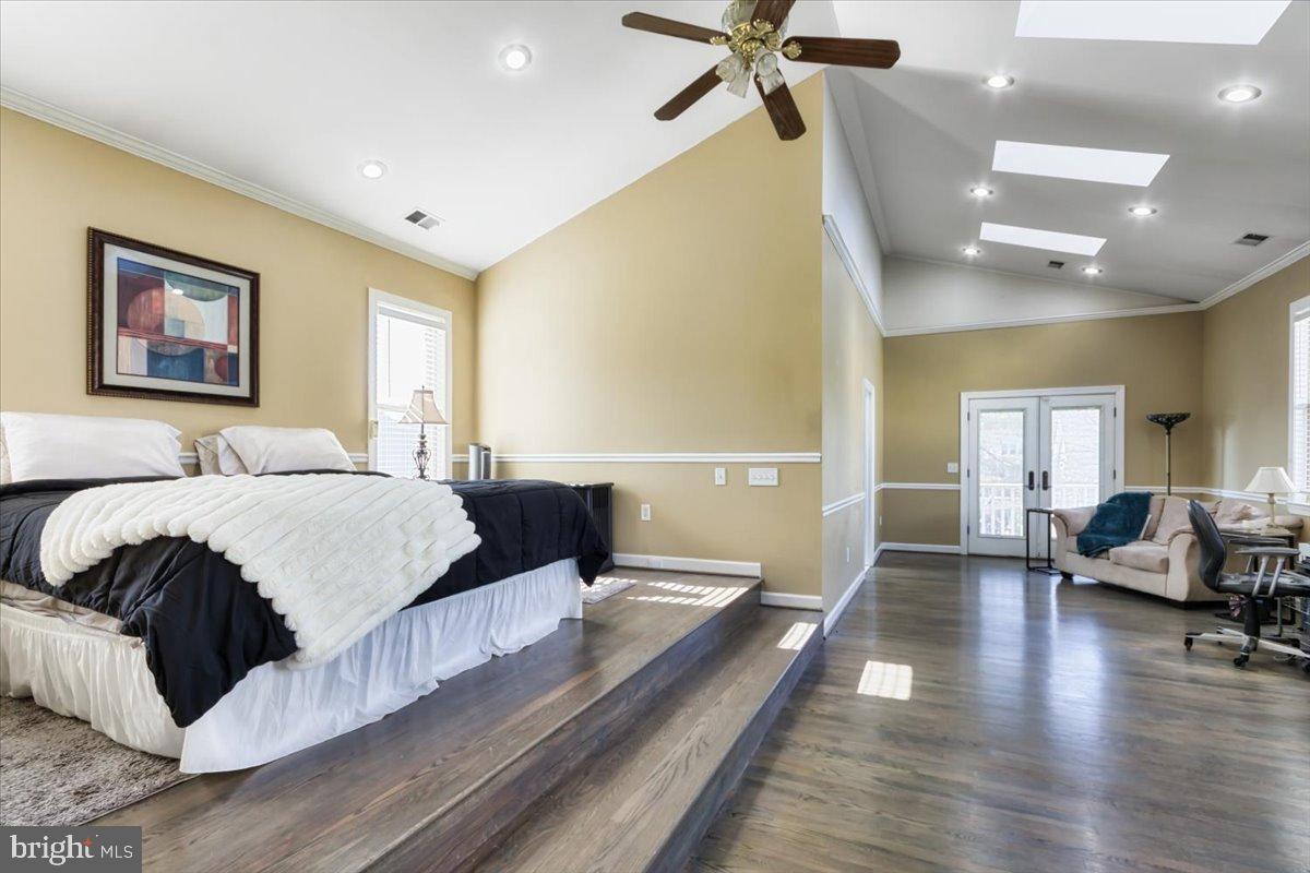 5306 Morello Road Baltimore, MD 21214 - Photo 25 of 37 a spacious bedroom with a bed and wooden floor